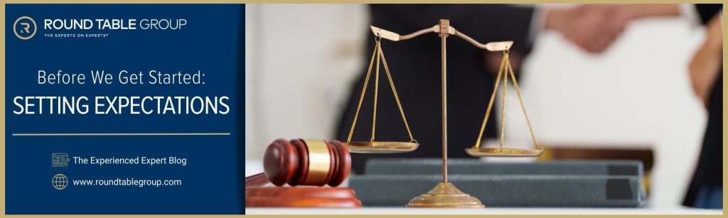 Handshake between legal professionals. Scale and gavel in forefront.